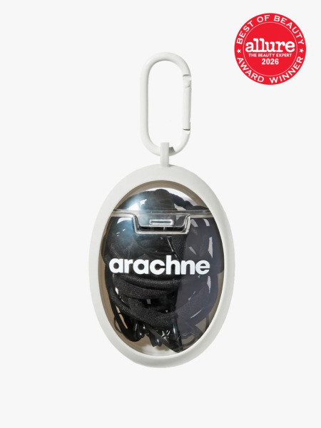 Arachne L'UOVO The Everywhere Essentials Egg in branded component on a light gray background with the 2026 best of beauty seal in the top right corner