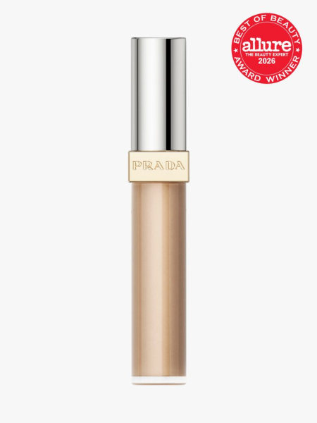 Clear tube of Prada Beauty Conceal with silver cap and an Allure Best of Beauty stamp in top right corner on a light gray background