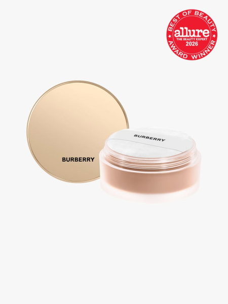 Gold container of Burberry Beauty Beyond Wear Finishing and Smoothing Loose Powder with Allure Best of Beauty stamp in top right corner on a light gray background