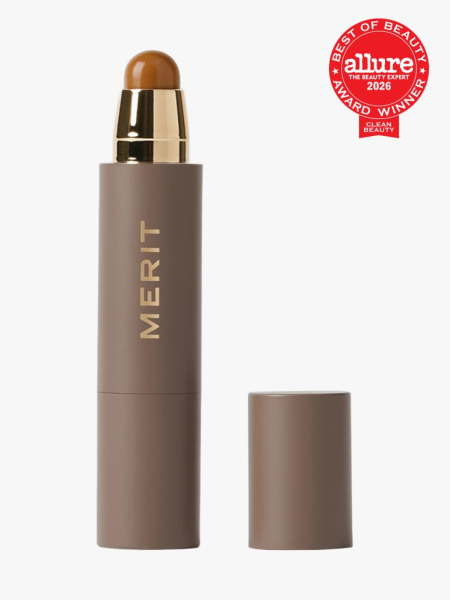 Merit The Minimalist Perfecting Complexion Stick in branded component on a light gray background with the 2026 best of beauty clean beauty seal in the top right corner