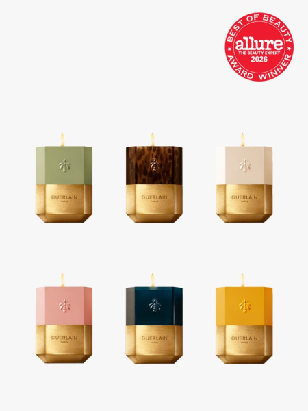 6 gold Guerlain L’Art & La Matière Scented Candles with Allure Best of Beauty stamp in the top right corner on a light gray background
