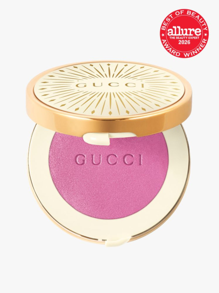 Gold container of Gucci Beauty Glow Blush with Allure Best of Beauty stamp in top right corner on a light gray background
