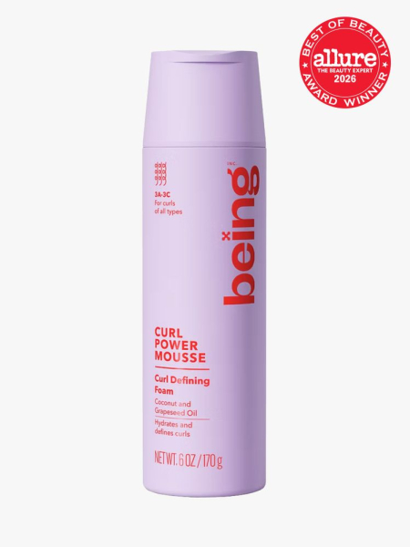 Being Haircare Curl Power Mousse purple bottle on light gray background with red Allure Best of Beauty seal in the top right corner