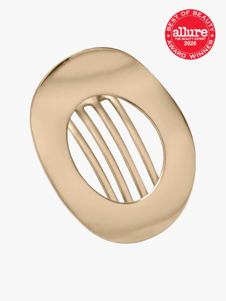 The Hair Edit Gilded Ellipse Flat Lay Claw Clip in branded component on a light gray background with the 2026 best of beauty seal in the top right corner
