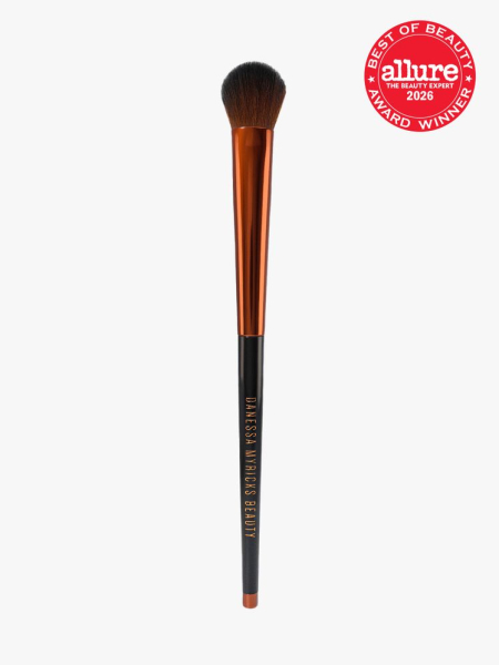 Danessa Myricks Beauty Yummy Face 3.0 All Over Concealer Brush in branded component on a light gray background with the 2026 best of beauty seal in the top right corner